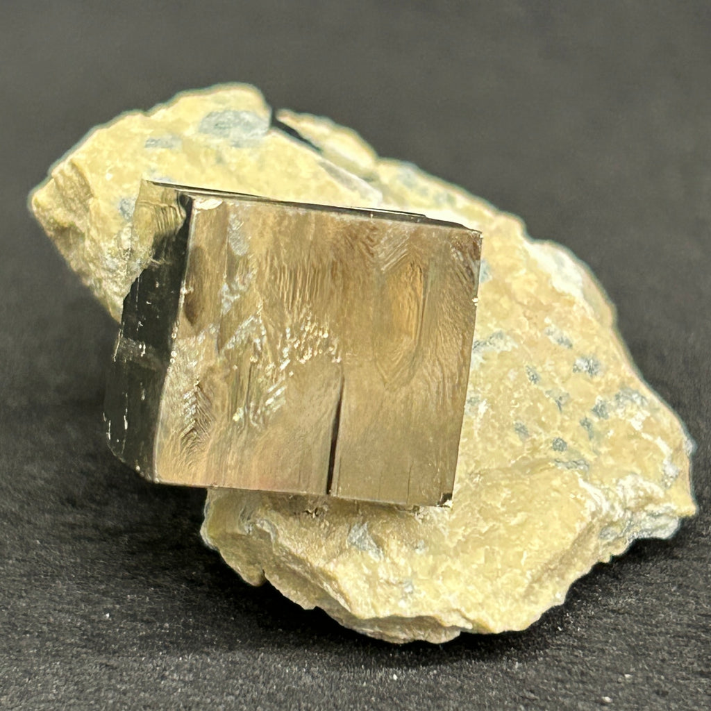 ** This higher quality pyrite cube specimen with excellent edges, faces and mirror luster, (in a limestone matrix) was obtained from a family that carefully extracts some of the best pyrite available in the world from their mine ( Alcarama mountain-chain ) in Navajun. La Rioja, Spain.