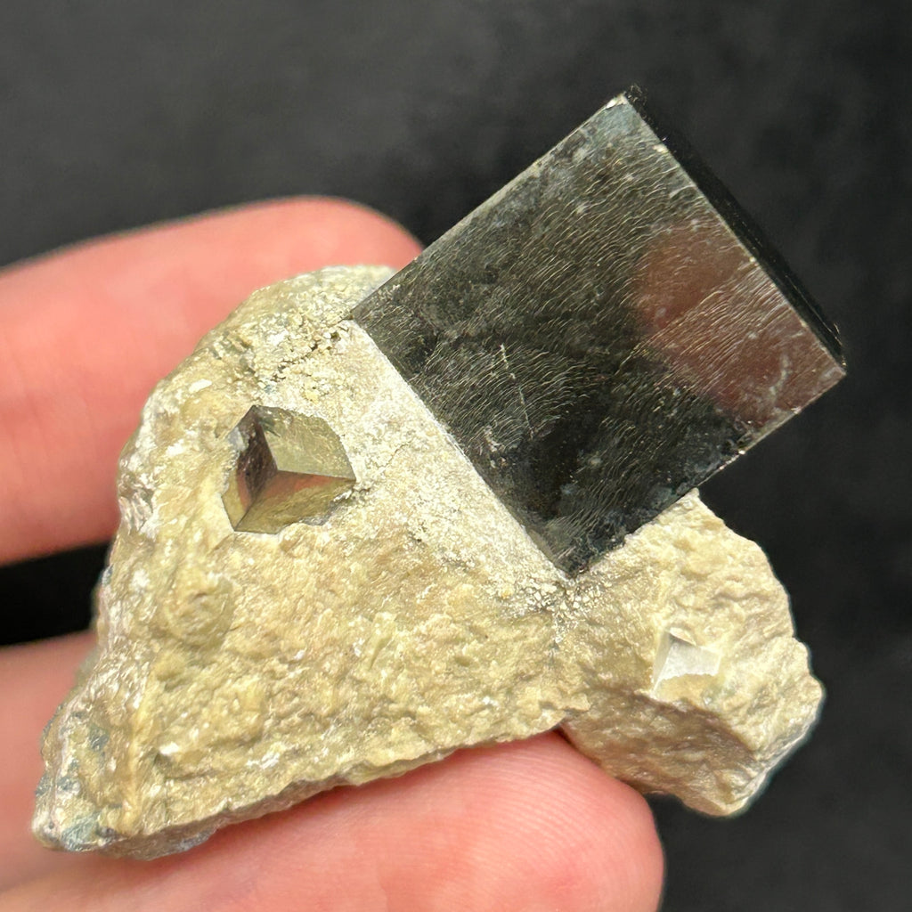 Exhibited is a well formed, beautiful higher quality** crystal specimen with attractive mirror-like metallic luster and fascinating growth patterns on faces. There are two cubes present. 44 grams.