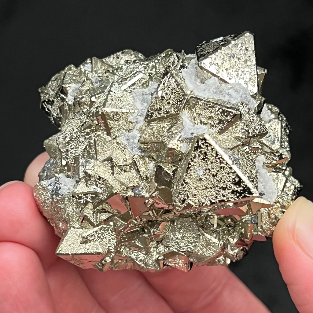 This is a gorgeous, higher quality octahedral Pyrite cluster with excellent, extremely bright silver metallic mirror luster and Quartz var. Chalcedony between some of the crystals. 