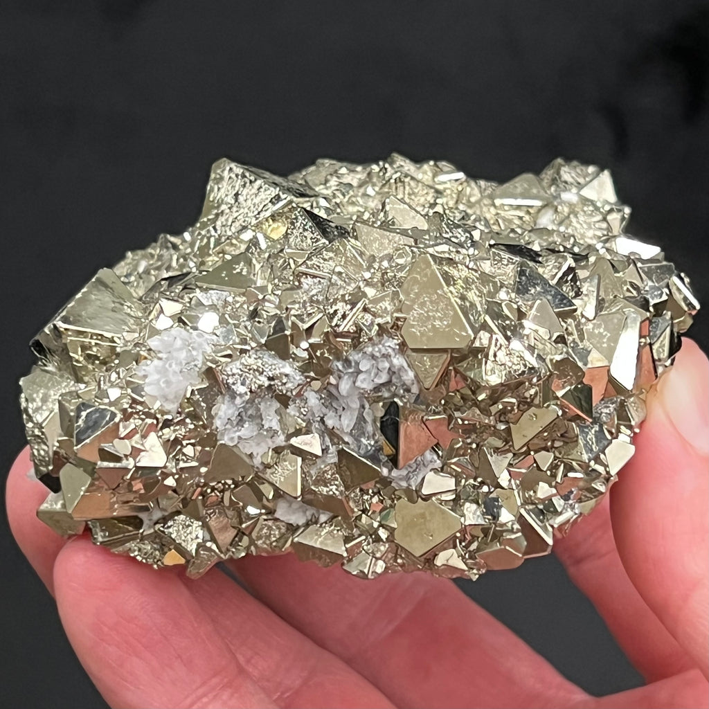 All of the faces of these crystals are very brightly reflective.  The source for this exceptional, extremely bright octahedral Pyrite crystals cluster with polycrystalline growth is the Huanzala Mine, Huallanca, Bolognesi Province, Ancash, Peru.