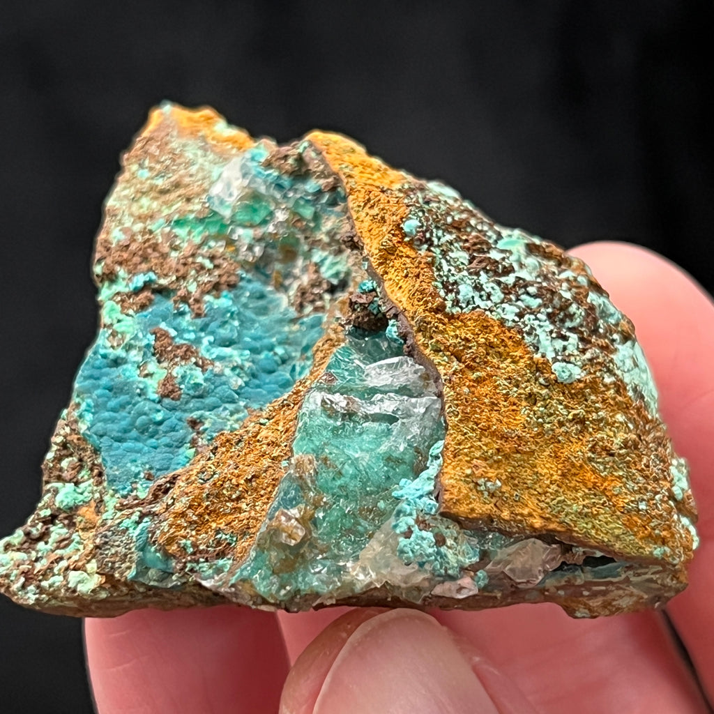 Rosasite like this one is a less common mineral that is found in the secondary oxidized zone of copper-zinc deposits.
