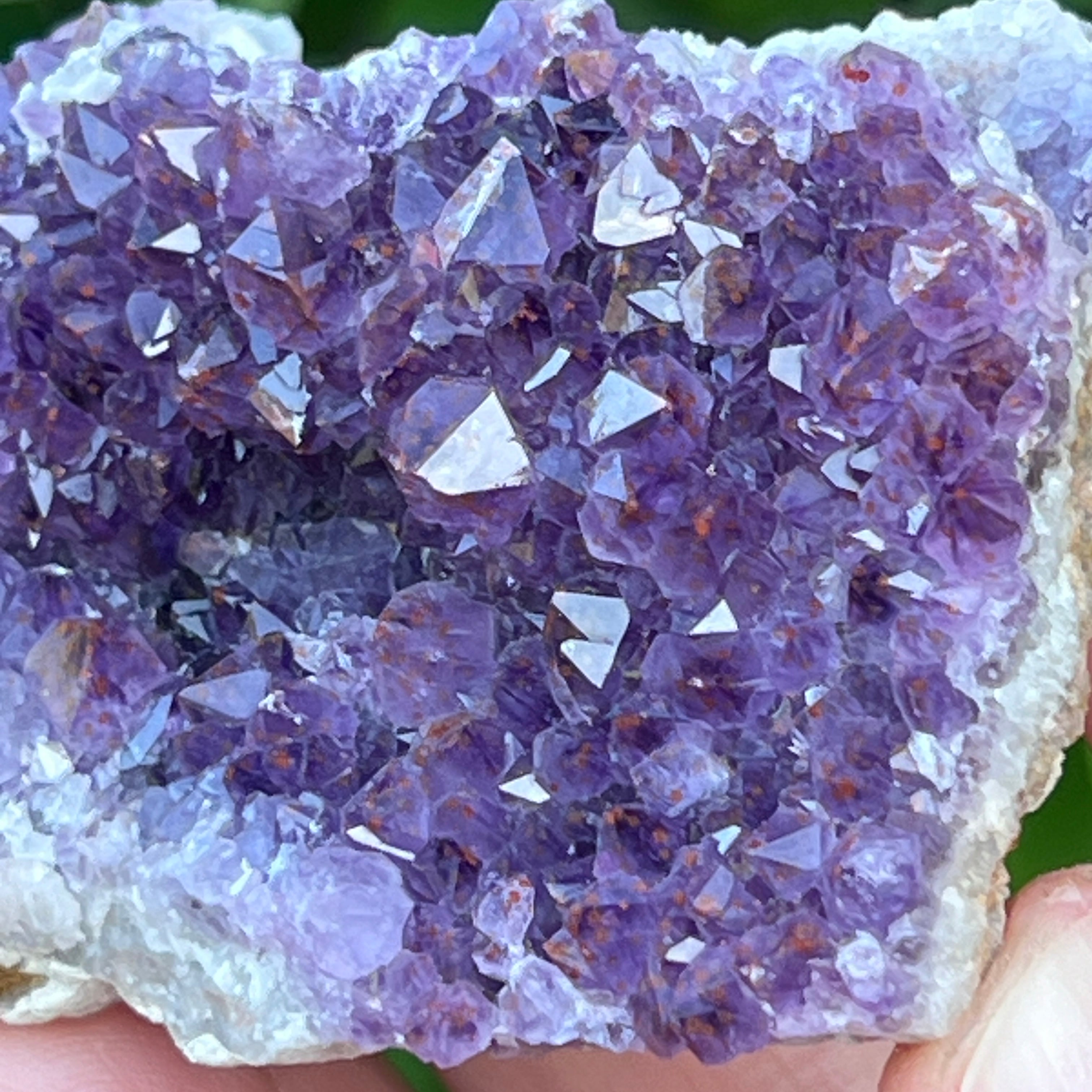 Red Hematite included Quartz, dark purple Amethyst. Exceptional luster and sparkle! The hematite presents speckled both in and on the crystals.