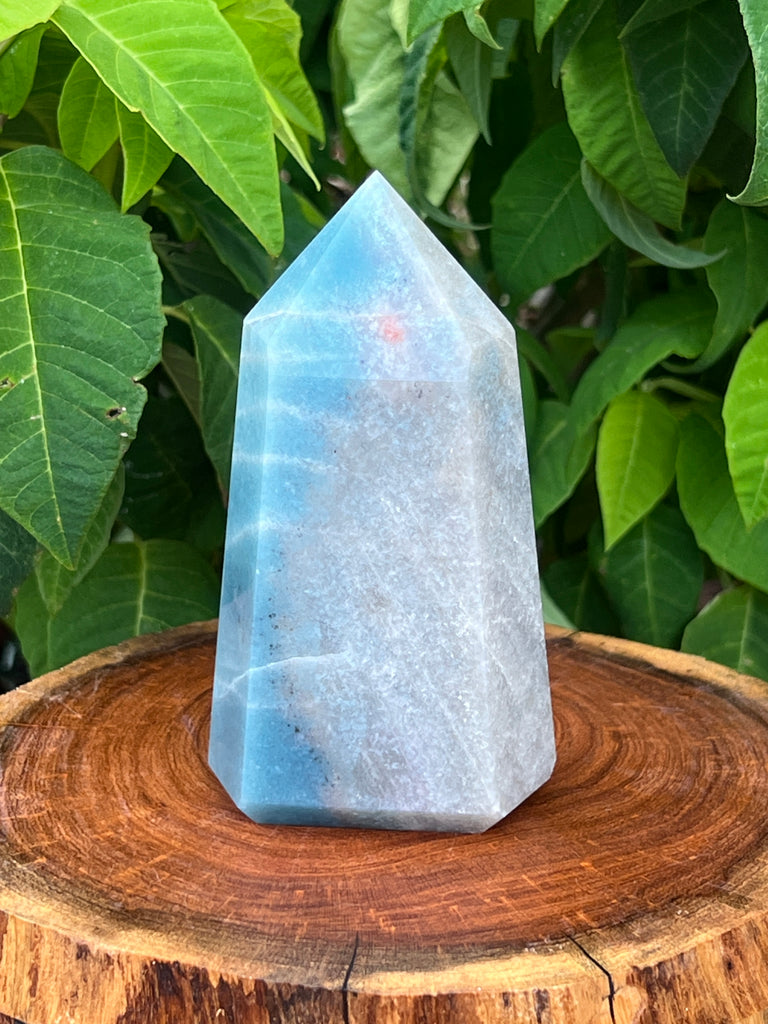From a new group we're happy to present, here is a beautiful, polished stone tower that has been found to mineralogically exhibit with some or all of the following minerals: quartz, lepidolite, blue tourmaline, scorzalite, and lazulite.