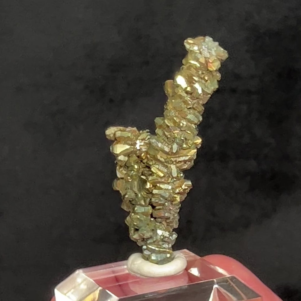 Here is a cool Marcasite Stalactite formation, exhibiting not only an overall fun saxophone presence, but also intriguing brassy, metallic luster orthorhombic crystals, some twinned, and others iridescent, hence the flash of colors as the piece is put in motion. 