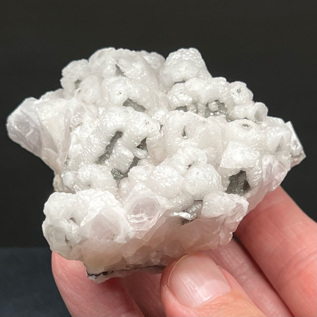 This is unusual Columnar Poker Chip Calcite specimen appears to present with two habits, hexagonal and scalenohedral.