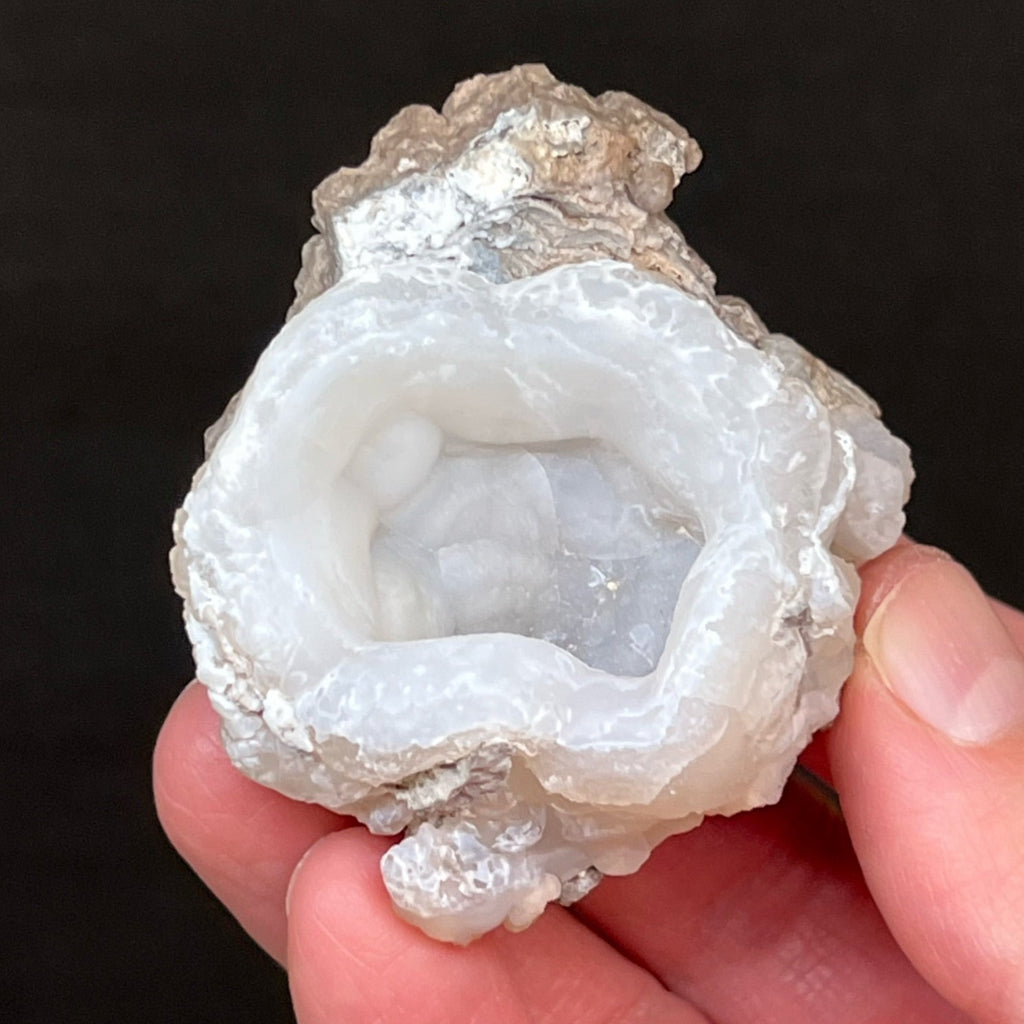 This interesting Chalcedony Cup specimen exibits an undulating botryoidal presence in the pocket or mouth-like interior.