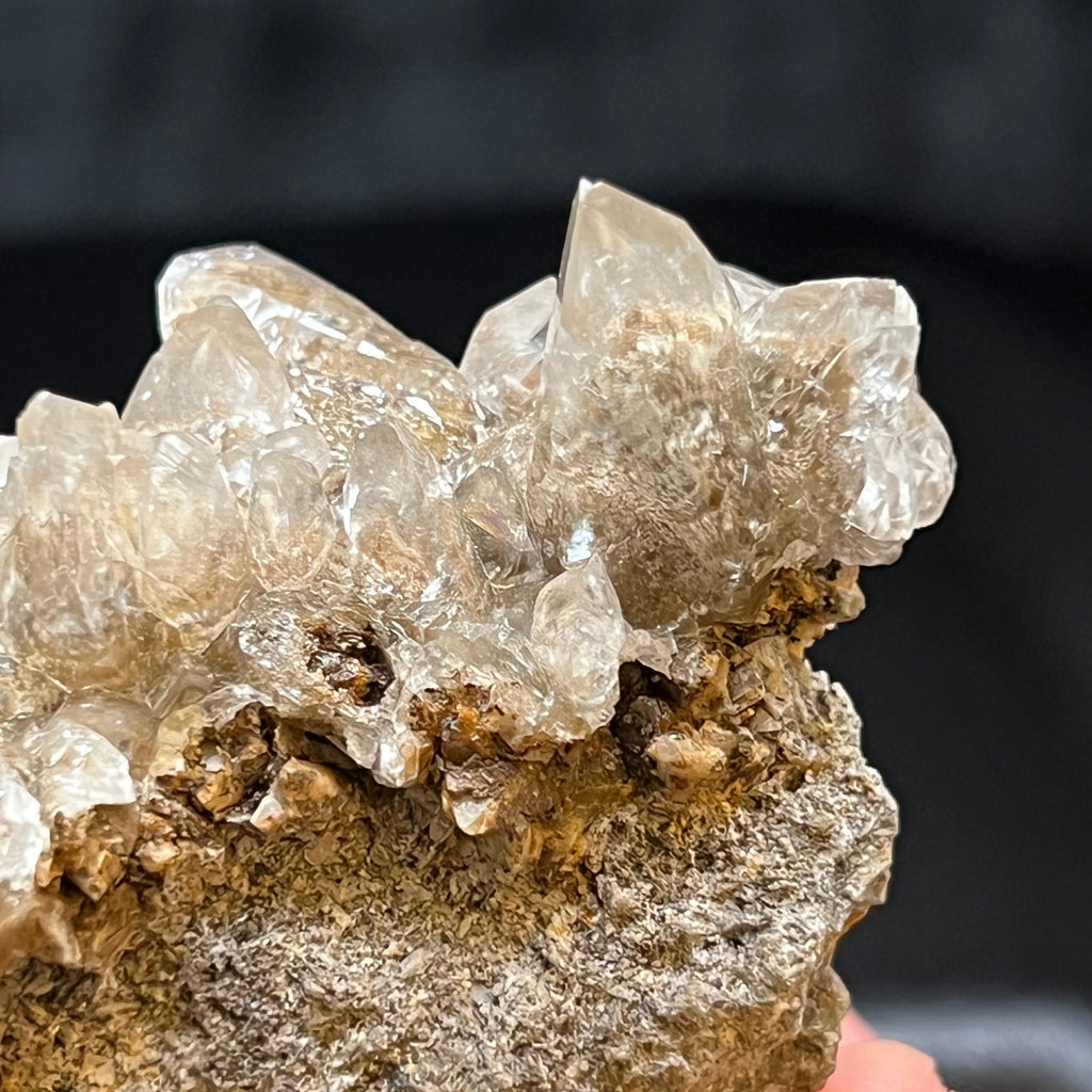 The interiors of the Calcite where the Todorokite inclusions occur cause the crystals to present with an intriguing "garden quartz" or "lodolite" appearance.