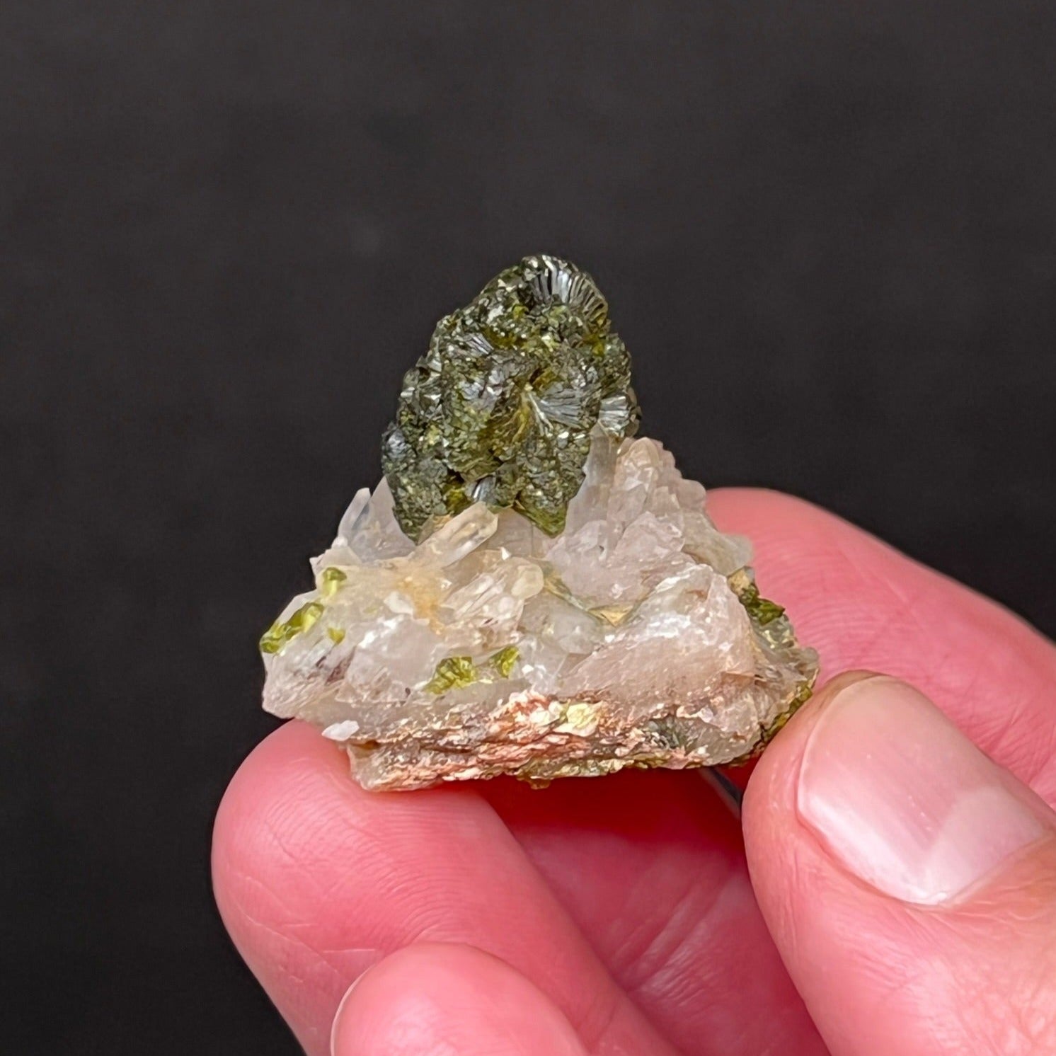 The roundish, ball-like cluster of deep, dark green Epidote crystals presents perfectly placed in this very aesthetic specimen.