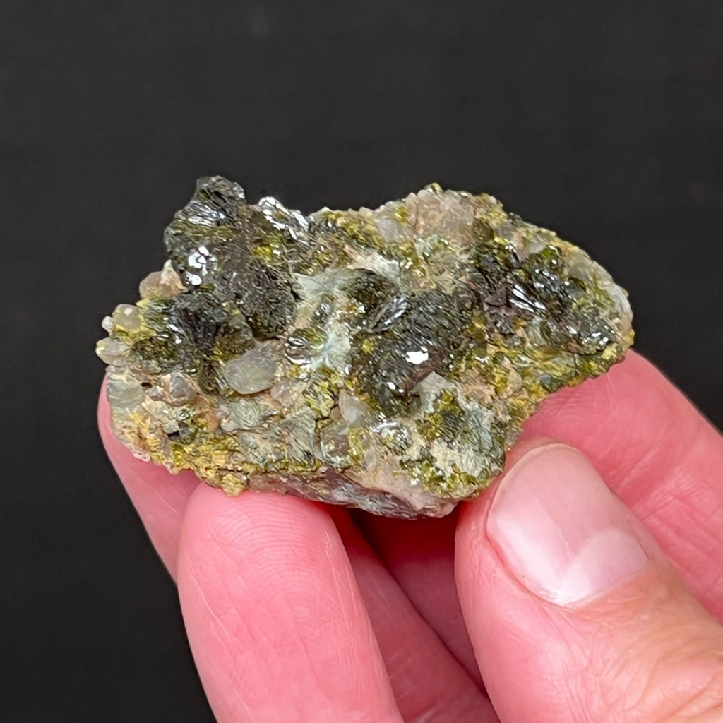 This specimen exhibits contrasting deep, dark green, very lustrous Epidote with terminated and interestingly naturally etched Quartz crystals. 