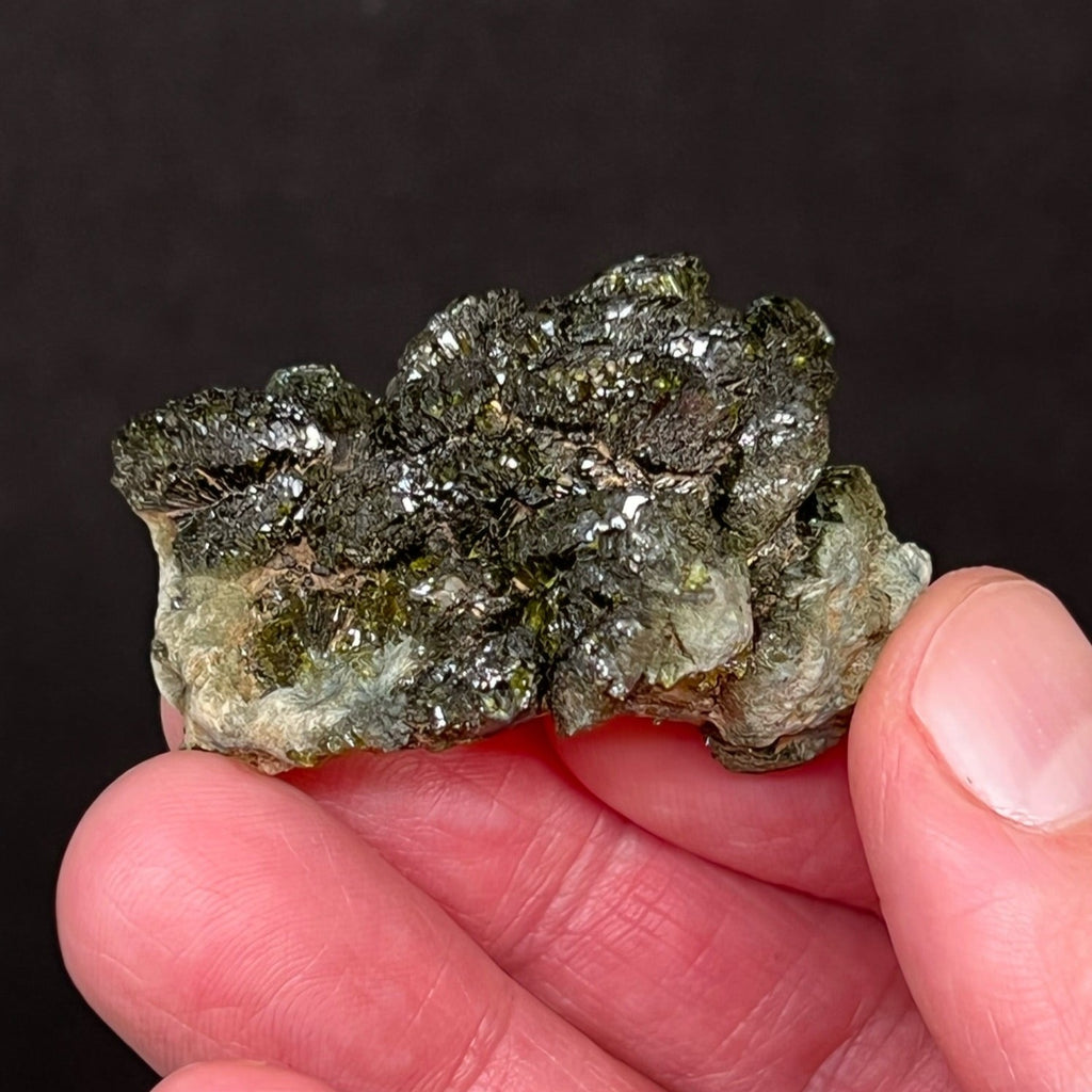 This is a marvelous, quality Epidote specimen with a dark green, lustrous cluster of well formed, prismatic fan-shaped crystals. 