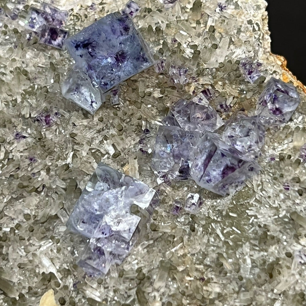 The clarity of the majority of the Fluorite crystals is superb, with a mix of both smooth faces and stepped, complex, natural, scalloped etched surfaces. 
