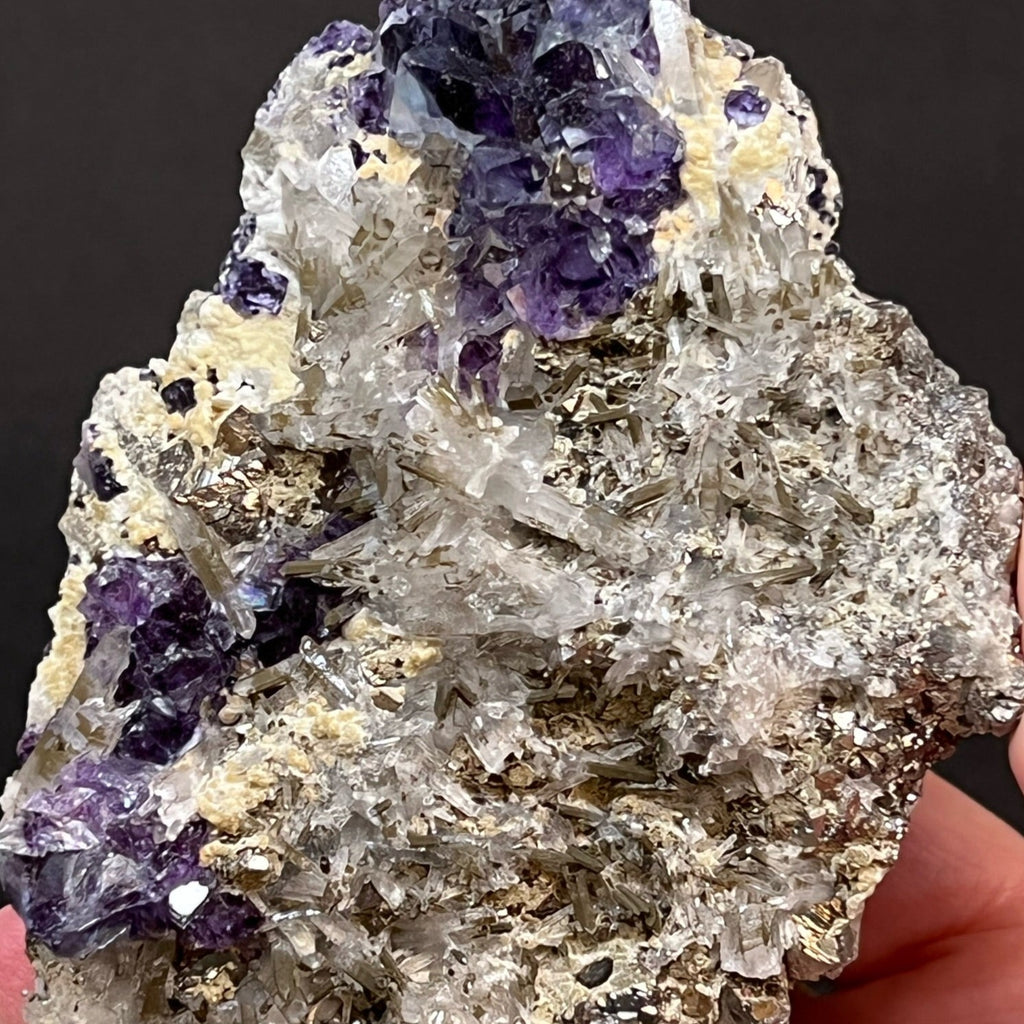 Some of the Fluorite in this specimen presents with fascinating zoning, varying saturations of dark blue, light blue, purple hues with translucent to transparent crystals. 