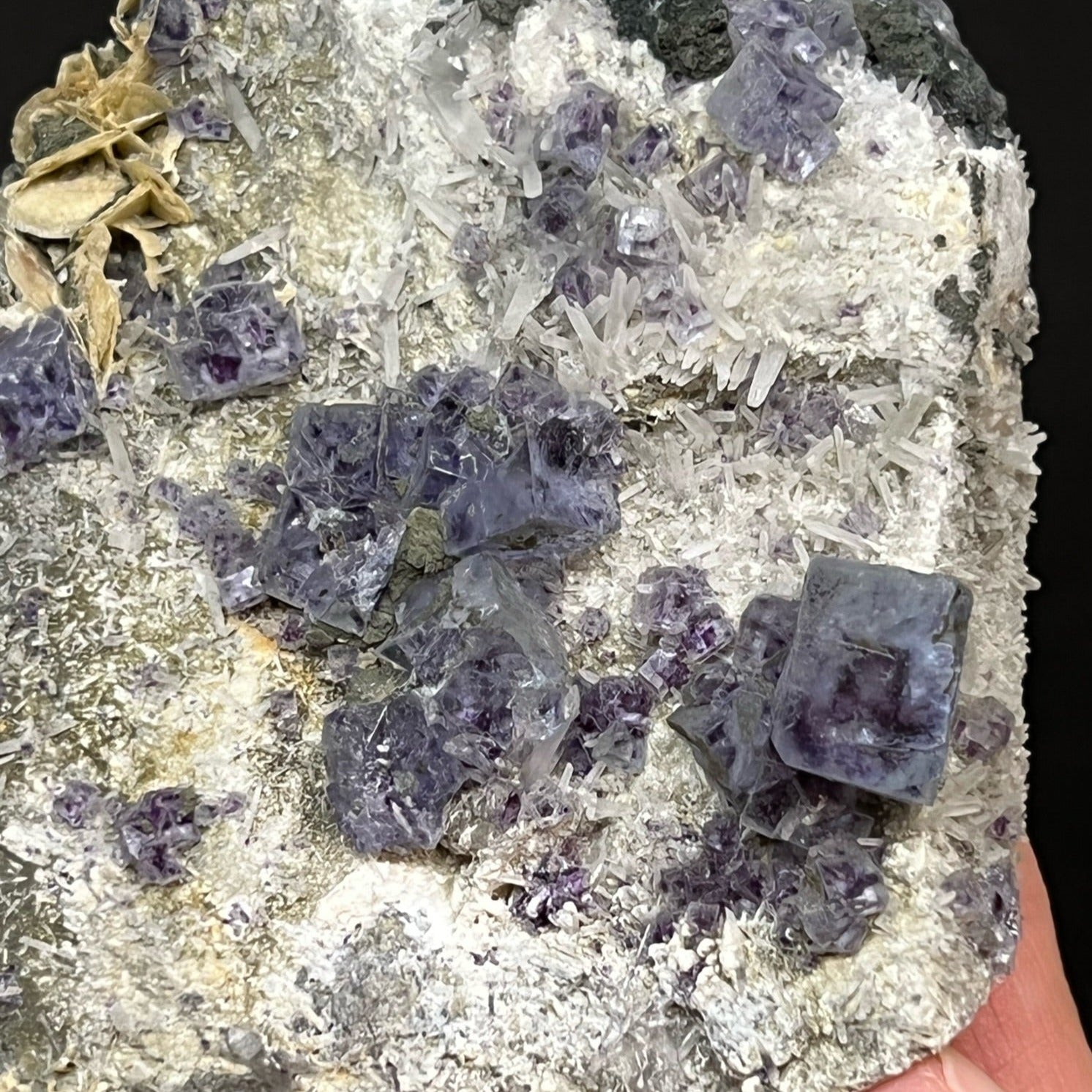 Fine Needle Quartz, some lightly dusted with Chlorite,  interestingly present across the surface, giving the specimen an interestingly landscaped look.