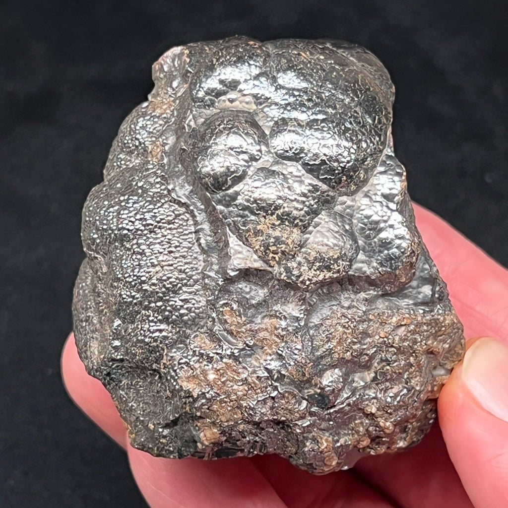 Hints of reddish Hematite or oxidized iron appear in some areas and peek out from between the botryoidal habit.  See further in the listing description for a mineralogical explanation and more information about the occurrence of the red color in Hematite. 