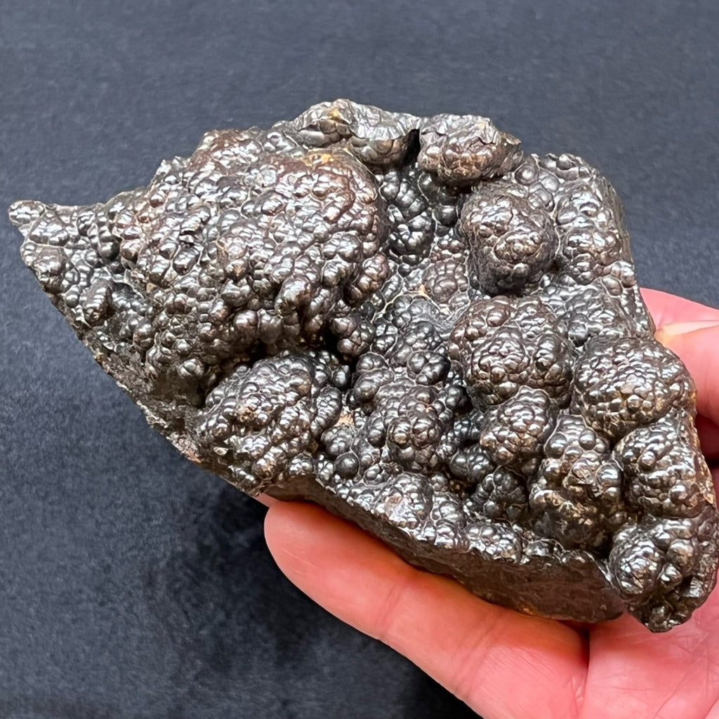 This is an intriguing, 100% all natural, large Hematite specimen with a vast number of botryoidal structures appearing to grow on top of other botryoidal formations for an overall very unusual and fascinating presentation.