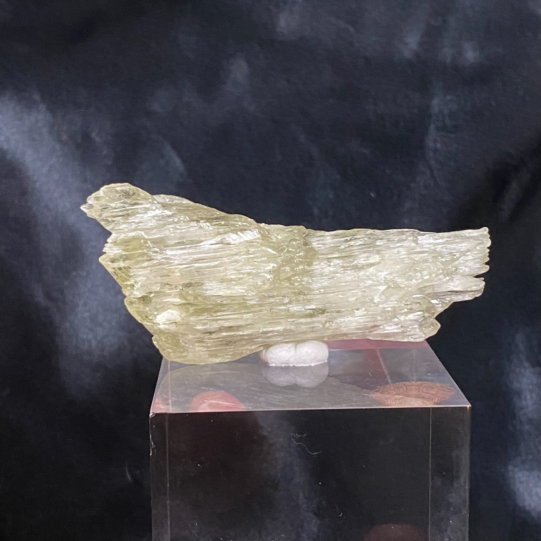 Prevalent thought amongst mineralogists is that this crystal is truly a green form of Spudomene var. Kunzite, and that the green color in this variety of Kunzite is the result of iron rather that chromium.