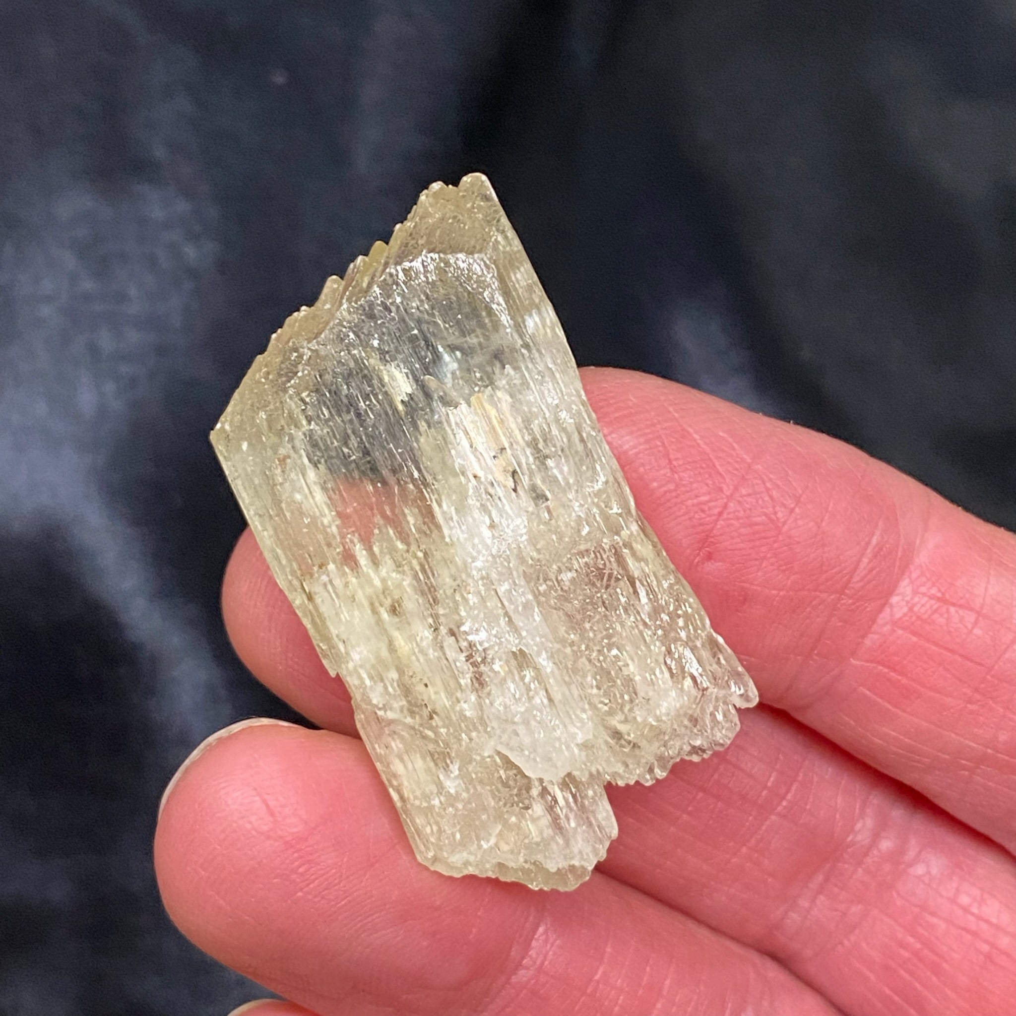 This is a beautiful light green, lustrous Spodumene var. Kunzite transparent / translucent specimen from Pakistan that is often referred to as "Hiddenite". 24 grams. 1.82" x .96" x .43" or 46.4mm x 24.4mm x 10.9mm. 