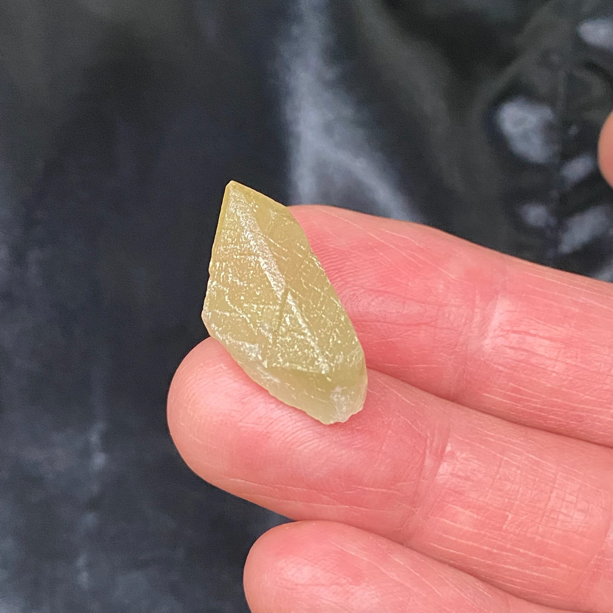 This is a beautiful light green, lustrous Spodumene var. Kunzite transparent / translucent specimen from Pakistan that is often referred to as "Hiddenite". 7 grams. .94" x .52" x .63" or 24mm x 13.2mm x 16.2mm.