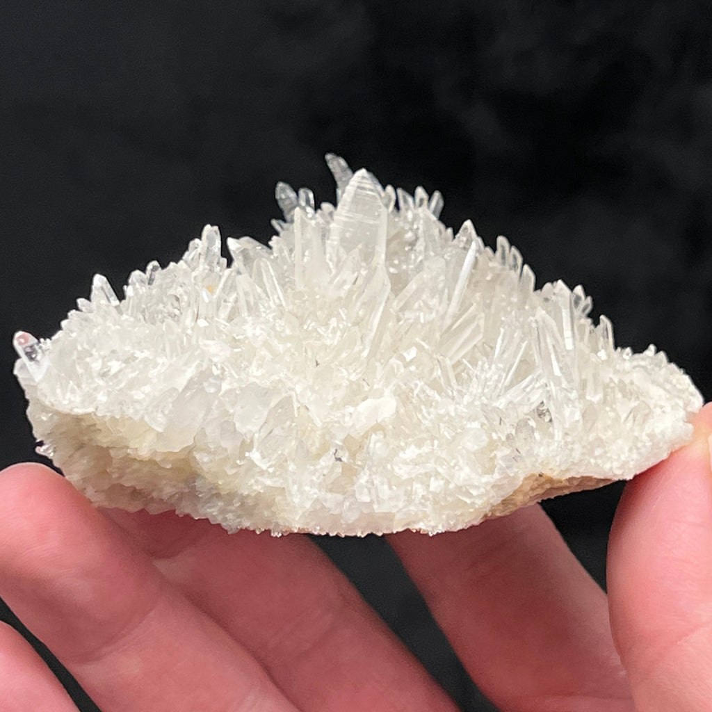 This is a beautiful cluster of needle Quartz presenting with excellent clarity and at least four Japan Law Twins nestled in the sparkling specimen. 