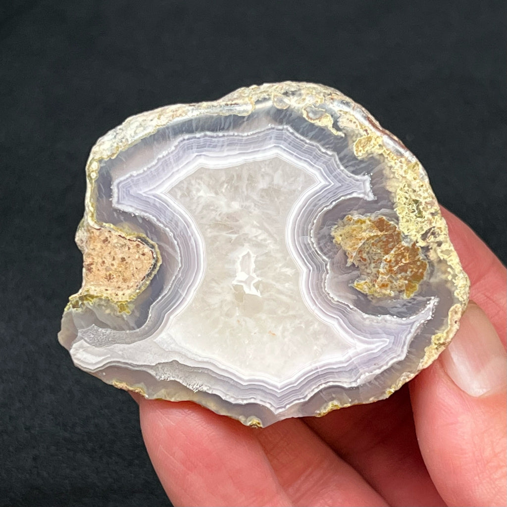 The smaller side of the thunderegg is 97 grams and measures 2.35" x 2.01" x 1.11" or 59.8mm x 51mm x 28.4mm. 