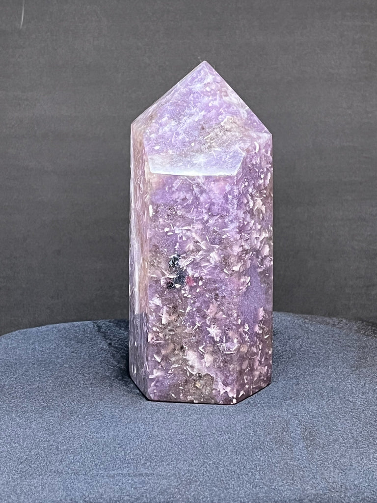 The polish on this Lepidolite tower or obelisk is excellent. exhibiting a nice shine.
