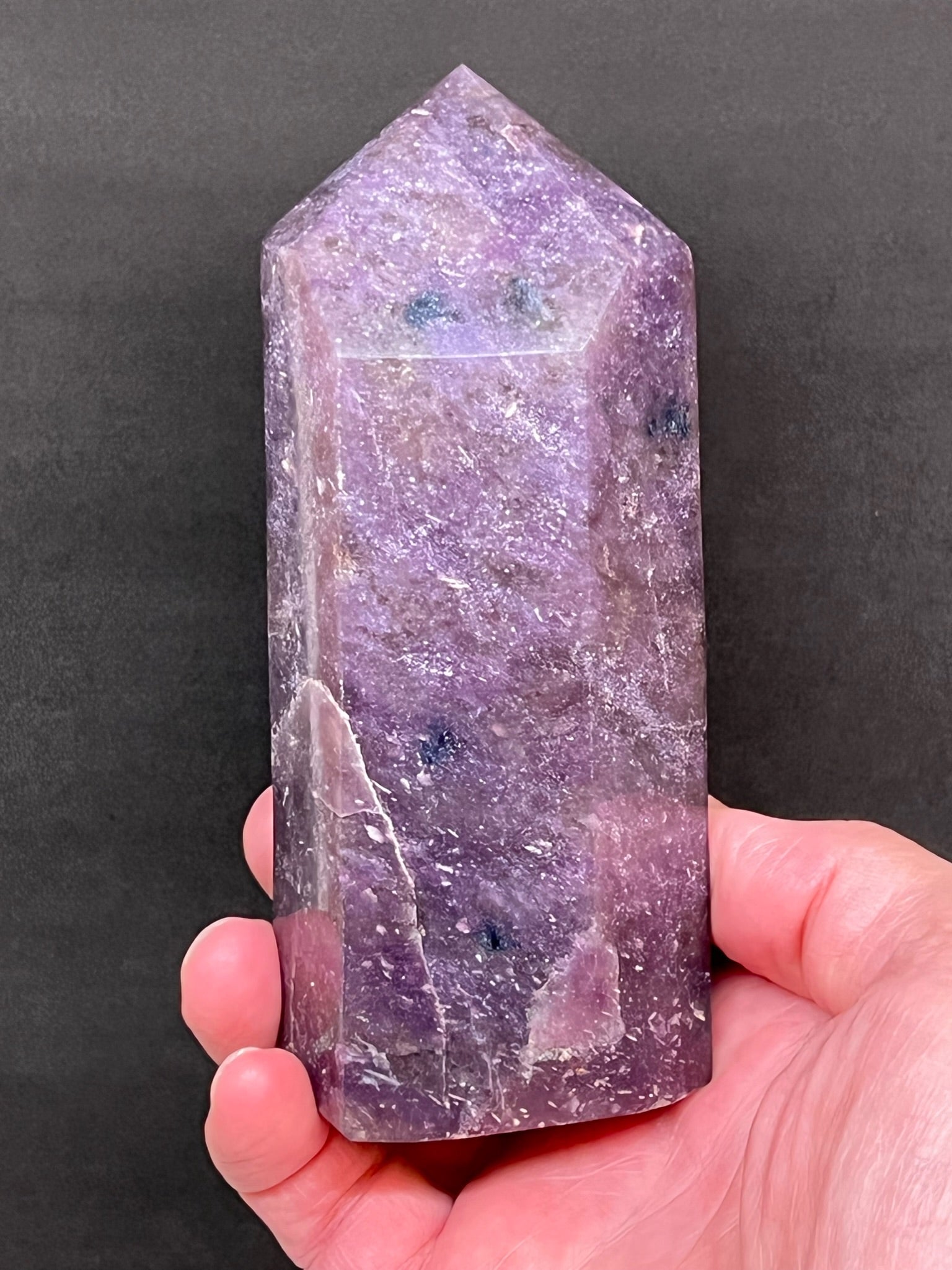 This is an excellent, natural, deep bluish-purple Lepidolite tower or obelisk with an excellent polish on all sides exhibiting flickers of mica and varying saturations of green-gray to dark green Chromium included in the  Quartz. 