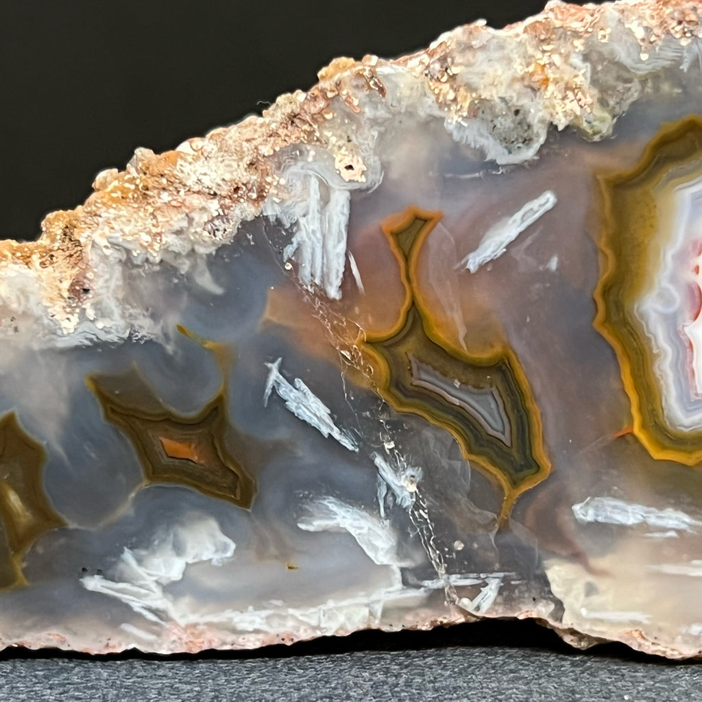 This Moroccan Agate specimen measures 4.9" x 1.68" x 1.13" or 124.6mm x 42.8mm x 28.8mm.  The translucent attributes of this specimen present a sort of  multidimensional appearance where you can see the intriguing structure of the patterns deeper in the quartz var. chalcedony. 