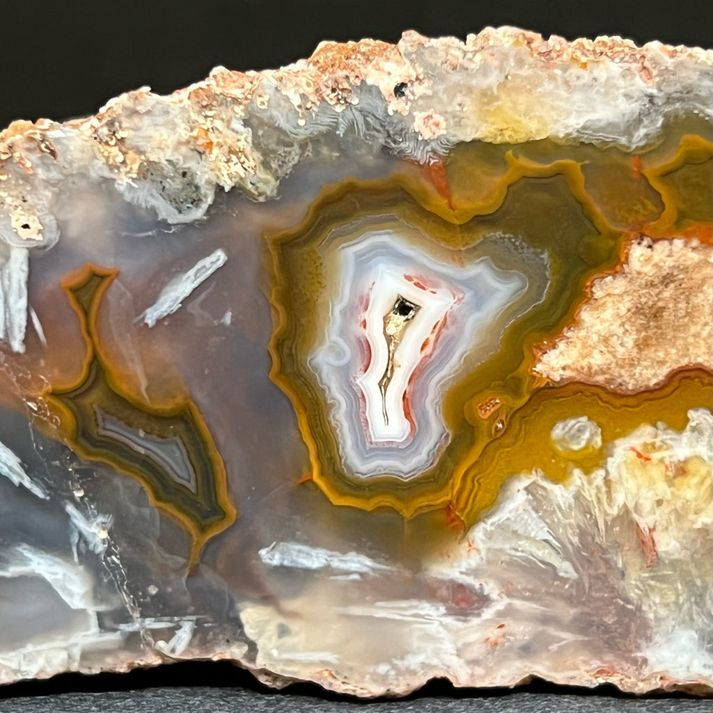 Banding, fortification and burst patterns are attractively evident in this Moroccan Agate specimen.