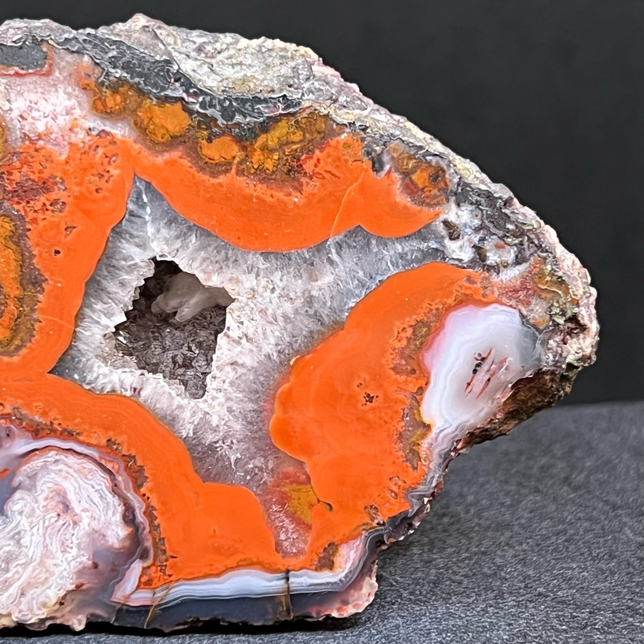 White quartz var. chalcedony areas in this Moroccan Agate present with both a gentle flowing characteristic and swirling, plume-like layered patterns that really draw you in to take a closer look. 