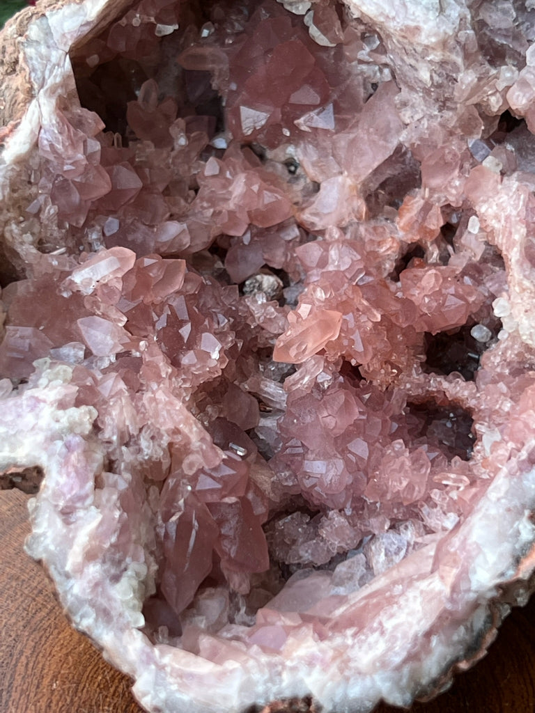 Beautiful, linear growing, bridge-like formations of Pink Amethyst Crystals present in many places in this geode.