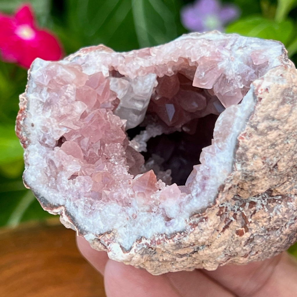 A bridge-like structure of secondary growth Calcite crystals presents closely to the outstanding larger Calcite crystals. The terminations of the crystals in this Pink Amethyst specimen are excellent.