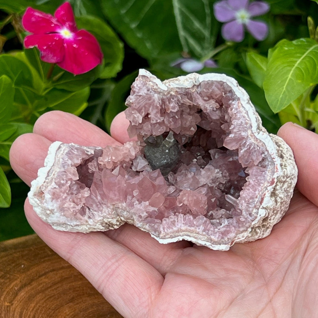 We love the cool clusters of Pink Amethyst in this specimen.  Of particular note is the larger cluster of crystals nearest the edge of the geode, just under the manganese glazed Calcite.