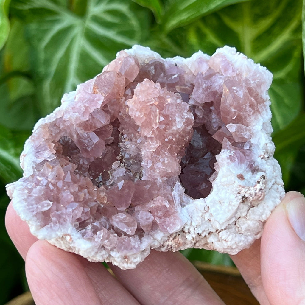 This is an outstanding, beautiful, quality, Pink Amethyst Crystals Geode specimen with excellent darker pink color, featuring a fascinating, unusual stalactite like formation of crystals near the center of the specimen with a double terminated crystal perched near the the top.