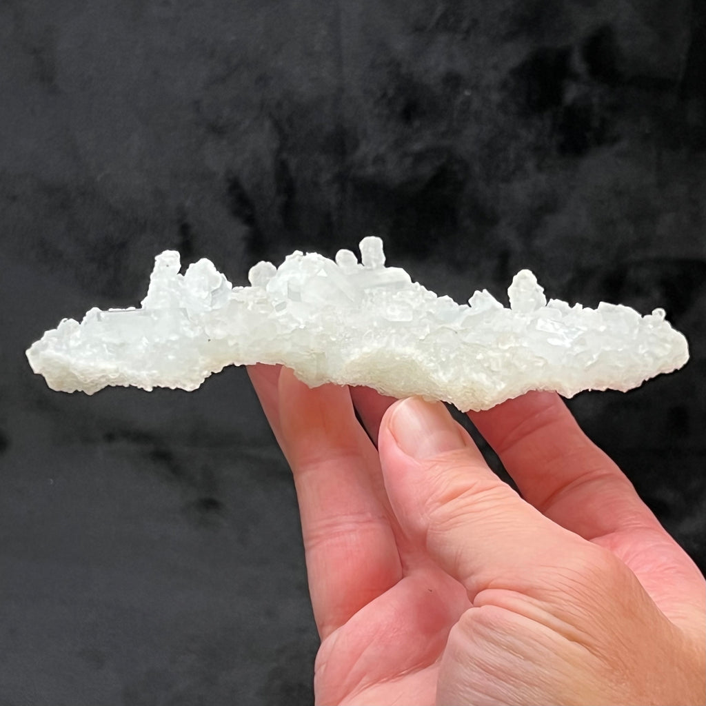 The profile of this terrific Prehnite pseudomorph after Laumontite is truly interesting with the fingers of crystals standing up on the specimen.