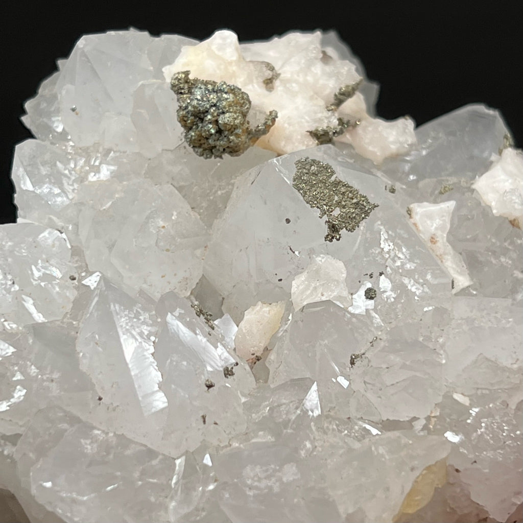 Very fine sparkling silvery gold pyrite appears spread and sprinkled on this Quartz, Calcite, Pyrite and Fluorite specimen. 