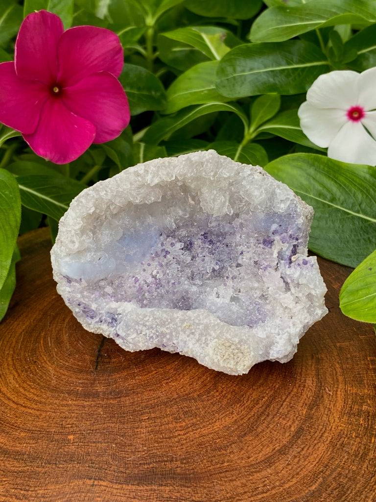Spirit Flower Geodes combine the soft contours of botryoidal blue and white Chalcedony with sparkling druzy-like quartz crystals and blue-purple Fluorite, presenting an overall soft bluish-purple hue to the geode. Fluoresces bright green-yellow under UV light. 