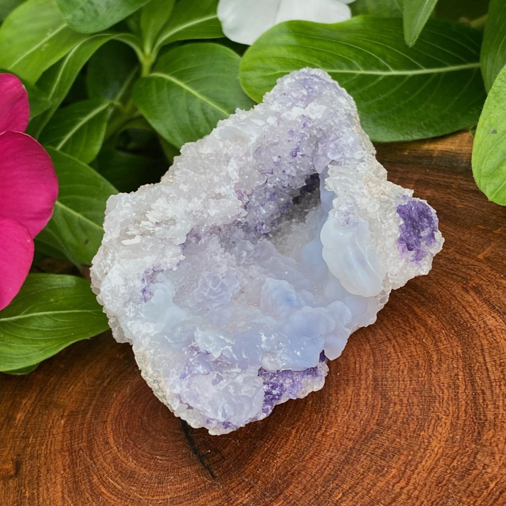 This is an outstanding Spirit Flower Geode specimen that presents with excellently formed light blue botryoidal chalcedony, sparkling quartz crystals, and clusters of fine, dark blue fluorite near the edges of the geode and sprinkled deeper in the pocket.   