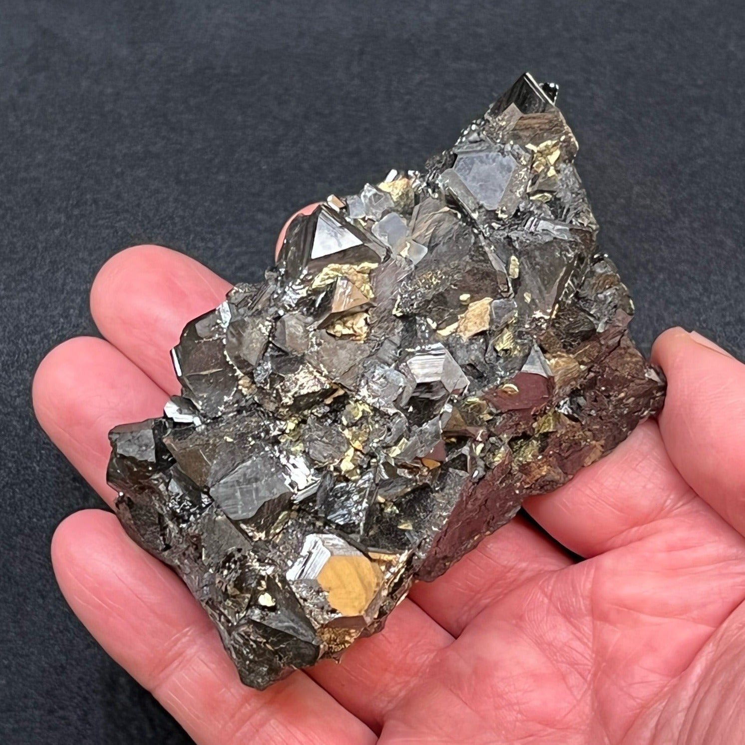This is an excellent, lustrous Sphalerite and Chalcopyrite crystals specimen with well formed tetrahedrons that present with shiny metallic gray-black faces and sharp edges.