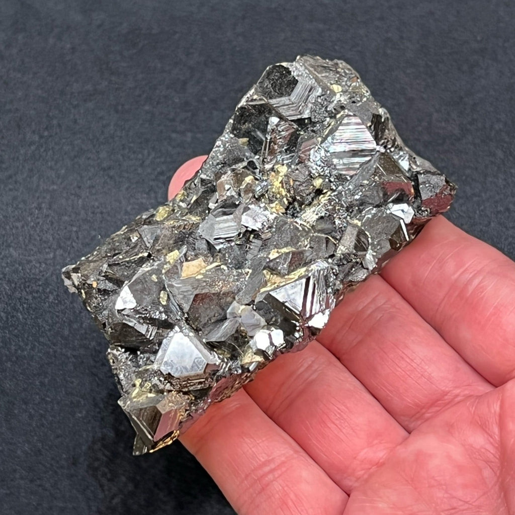 The euhedral tetrahedron Sphalerite crystals have a very shiny, reflective, mirror-like quality to the metallic-black faces. 