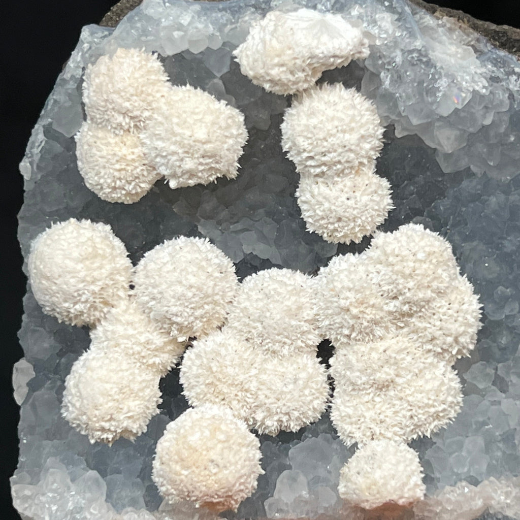 This Thomsonite on Quartz specimen is a very aesthetic piece to display on the top shelf of your collection.