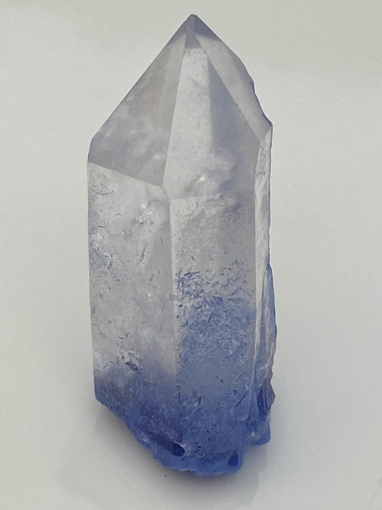 Important to note is that this specimen is presented without being attached with mineral tack to an acrylic base due to the majority of the occurrence of Dumortierite is evident on and in the base of the crystal. Source: Vaca Morte Quarry, Serra de Vereda, Boquira, Bahia, Brazil
