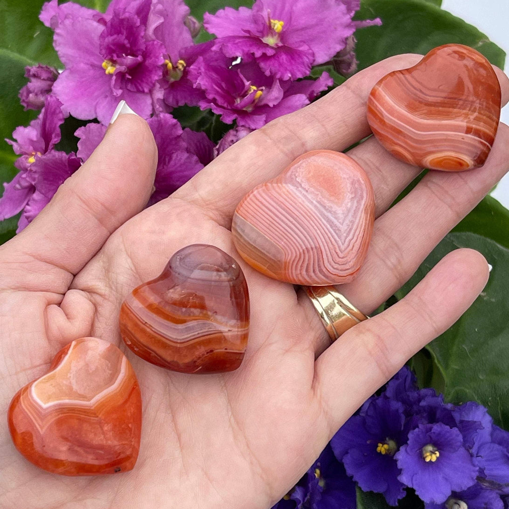 Carnelian Polished heart stones with nice banding.